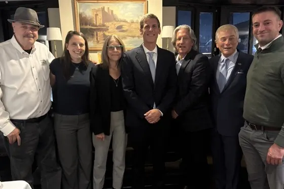 Co-op leaders and advocates standing with Assemblymember Ed Braunstein